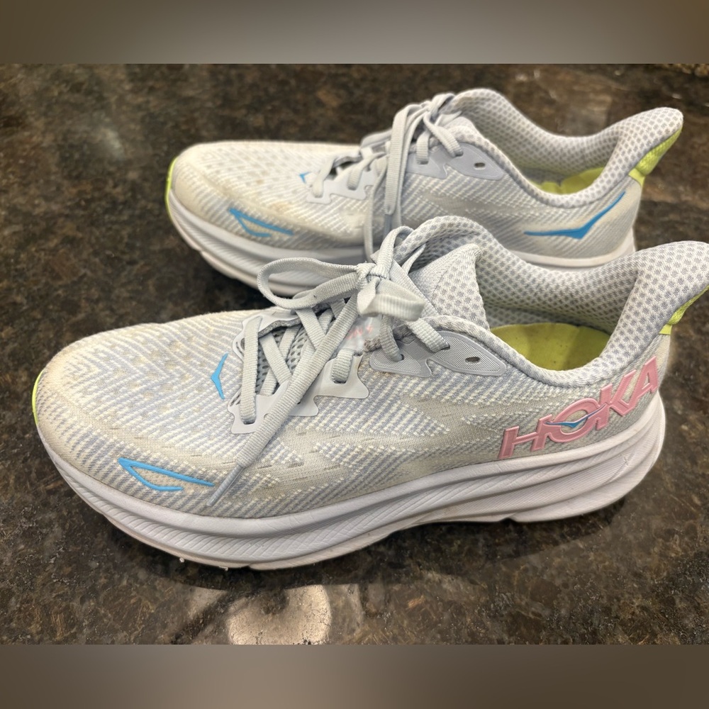 Hoka Women's White Running Shoes with Pink Logo and Light Blue Accents